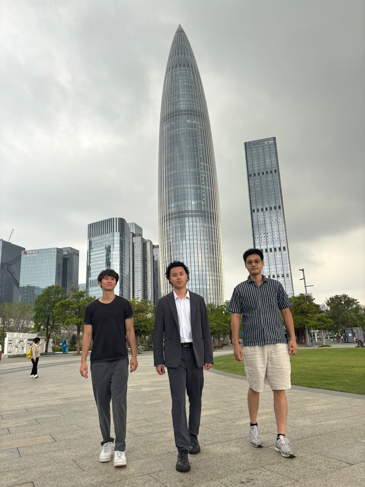 La Roja Travel team — Adam, Sean, and Chris in front of the China Resources Tower (Spring Bamboo) at Shenzhen Bay